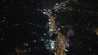 AX64_0330 - 5K aerial stock footage of Sunset Strip in West Hollywood, California, night