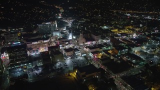 AX64_0336 - 5K aerial stock footage of Hollywood and Highland Center and office buildings on Hollywood Boulevard, California, night