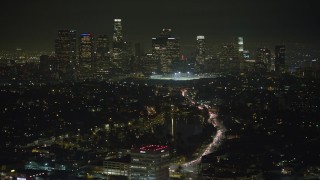 5K aerial stock footage of Downtown Los Angeles skyline viewed from Echo Lake, California, night Aerial Stock Footage | AX64_0347E