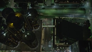 5K aerial stock footage of bird's eye of city streets, hotels, and skyscrapers, Downtown Los Angeles, California, night Aerial Stock Footage | AX64_0367