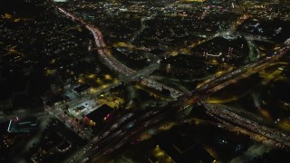 5K aerial stock footage bird's eye of heavy traffic on the 110 and 101 freeway interchange, Downtown Los Angeles, California, night Aerial Stock Footage | AX64_0395E