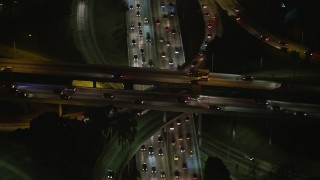 5K aerial stock footage of Highway 110 and Highway 101 freeway interchange, Downtown Los Angeles, California, night Aerial Stock Footage | AX64_0397E