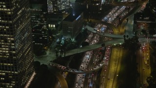 5K aerial stock footage tilt to heavy traffic on Highway 110, Downtown Los Angeles, California, night Aerial Stock Footage | AX64_0402E