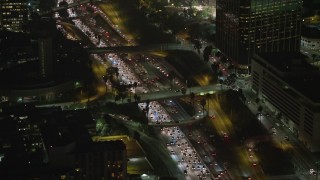 5K aerial stock footage of heavy traffic on Highway 110 and overpasses, Downtown Los Angeles, California, night Aerial Stock Footage | AX64_0414