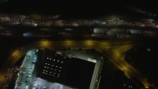 AX64_0431E - 5K aerial stock footage of a bird's eye view of heavy I-5 traffic at night, Burbank, California