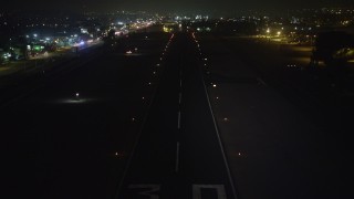 5K aerial stock footage of approaching a runway at Whiteman Airport, Pacoima, California, night Aerial Stock Footage | AX64_0445E