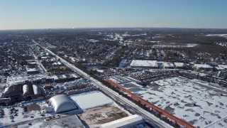 4.8K aerial stock footage of snow covered industrial area in Farmingdale, New York Aerial Stock Footage | AX66_0001