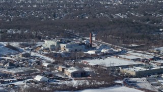 4.8K aerial stock footage factory with smoke stacks in snow, Farmingdale, New York Aerial Stock Footage | AX66_0004