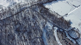 4.8K aerial stock footage of bare forest in snow, Old Westbury, New York Aerial Stock Footage | AX66_0019