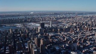 4.8K aerial stock footage of hospital buildings and city sprawl on Upper East Side, New York City Aerial Stock Footage | AX66_0057