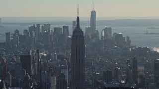 4.8K aerial stock footage of the Empire State Building, with Lower Manhattan in the background in winter, New York City Aerial Stock Footage | AX66_0210E