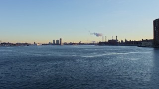 4.8K aerial stock footage of the Williamsburg Bridge on East River in winter, New York City, Sunset Aerial Stock Footage | AX66_0225