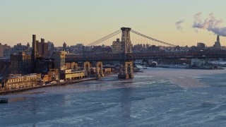 4.8K aerial stock footage of part of the Williamsburg Bridge on East River, New York City, sunset Aerial Stock Footage | AX66_0229