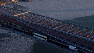 4.8K aerial stock footage approach and pan across heavy traffic on Williamsburg Bridge, New York City, sunset Aerial Stock Footage | AX66_0230E