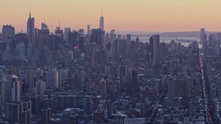 4.8K aerial stock footage tilt from Columbia University to Midtown skyscrapers in winter, New York City, twilight Aerial Stock Footage | AX66_0282