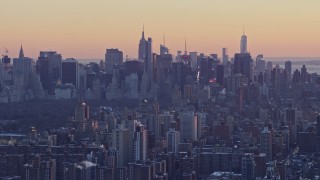 4.8K aerial stock footage tilt from Midtown skyscrapers to Columbia University in winter, New York City, twilight Aerial Stock Footage | AX66_0283