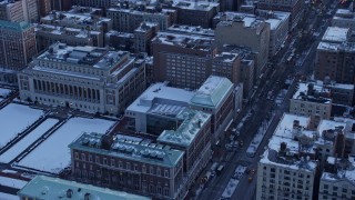 4.8K aerial stock footage of a bird's eye view of a Columbia University building in winter, New York City, twilight Aerial Stock Footage | AX66_0284E