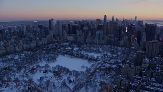 4.8K aerial stock footage wide view of Central Park and Midtown Manhattan in winter, New York City, twilight Aerial Stock Footage | AX66_0305E