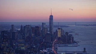 4.8K aerial stock footage of a wide view of Freedom Tower and downtown skyscrapers in winter, New York City, twilight Aerial Stock Footage | AX66_0343