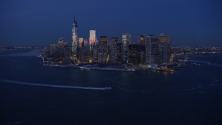 AX66_0376 - 4.8K aerial stock footage of Lower Manhattan skyline in winter, New York City, twilight