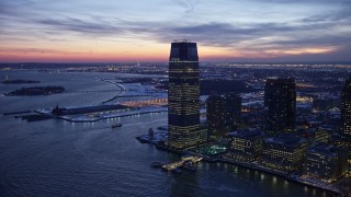 4.8K aerial stock footage of Goldman Sachs Tower in Jersey City in winter, New Jersey, twilight Aerial Stock Footage | AX66_0383