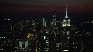 4.8K aerial stock footage of Empire State Building and Lower Manhattan skyscrapers, New York City, night Aerial Stock Footage | AX66_0437