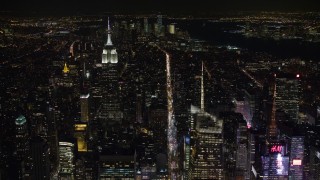 4.8K aerial stock footage view follow 6th Street toward Empire State Building in Midtown Manhattan at night, New York City, New York Aerial Stock Footage | AX67_0019