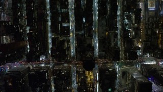 4.8K aerial stock footage view of bird's eye view of city streets in Midtown Manhattan at night, New York City, New York Aerial Stock Footage | AX67_0030