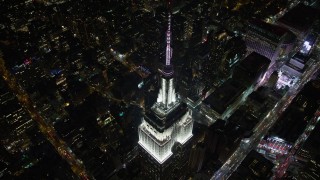 AX67_0039 - 4.8K aerial stock footage view approach the Empire State Building at night, Midtown Manhattan, New York City, New York