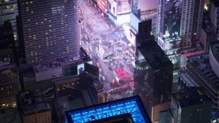 AX67_0042 - 4.8K aerial stock footage view of tourists visiting Times Square at night, Midtown Manhattan, New York City, New York