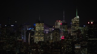 4.8K aerial stock footage view a group of towering skyscrapers at night, Midtown Manhattan, New York City, New York Aerial Stock Footage | AX67_0051