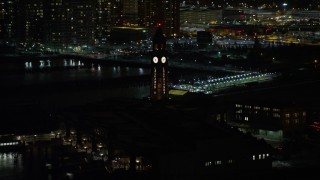 4.8K aerial stock footage view of approaching Hoboken Terminal at night, New Jersey Aerial Stock Footage | AX67_0066