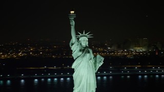 4.8K aerial stock footage view of orbiting the famous Statue of Liberty at night, New York Aerial Stock Footage | AX67_0072