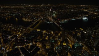 4.8K aerial stock footage view of approaching the Manhattan Bridge and the Brooklyn Bridge at night, New York Aerial Stock Footage | AX67_0087