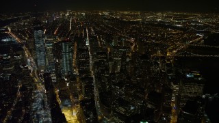 AX67_0095 - 4.8K aerial stock footage view of the south end of Lower Manhattan at night, New York