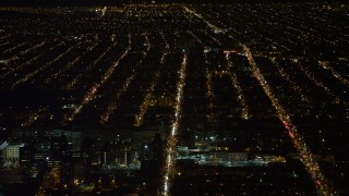 4.8K aerial stock footage view of flying over apartment buildings and reveal hospital in Brooklyn at night, New York Aerial Stock Footage | AX67_0104