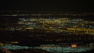 4.8K aerial stock footage view of flying by John F. Kennedy International Airport at night, New York Aerial Stock Footage | AX67_0108