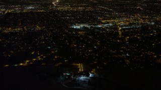 AX67_0113 - 4.8K aerial stock footage view of flying over urban residential neighborhoods in Queens at night, New York