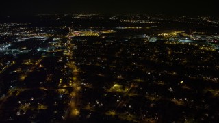 4.8K aerial stock footage view follow Hempstead Turnpike to reveal and approach Republic Airport at night, Long Island, New York Aerial Stock Footage | AX67_0120