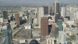 AX68_021 - 4.8K aerial stock footage tilt from Staples Center to reveal and approach Downtown Los Angeles towers, California