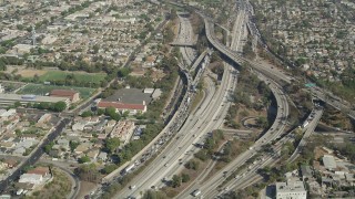 AX68_028 - 4.8K aerial stock footage of heavy traffic on the East Los Angeles Interchange in Boyle Heights, Los Angeles, California