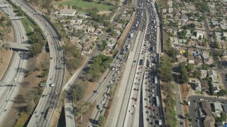 AX68_030 - 4.8K aerial stock footage fly over heavy traffic on Interstate 5 through Boyle Heights, Los Angeles, California