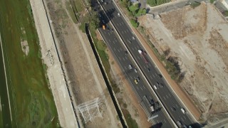 AX68_043 - 4.8K aerial stock footage of a bird's eye view of light traffic on I-710 through South Gate, Los Angeles, California