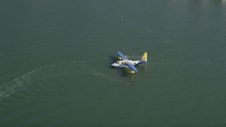 AX68_063 - 4.8K aerial stock footage of seaplane waiting for takeoff from San Pedro Bay, Long Beach, California