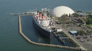 4.8K aerial stock footage tilt to reveal the Queen Mary Docked in Long Beach, California Aerial Stock Footage | AX68_064