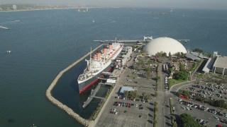 AX68_070 - 4.8K aerial stock footage orbit the RMS Queen Mary in Long Beach, California