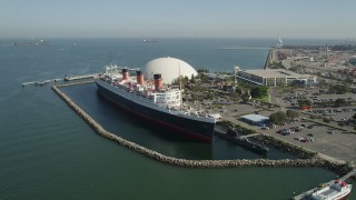 AX68_071 - 4.8K aerial stock footage orbit starboard side of the RMS Queen Mary luxury liner in Long Beach, California