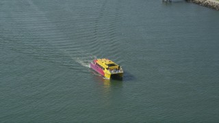 4.8K aerial stock footage of a small yellow and red ferry sailing San Pedro Bay in Long Beach, California Aerial Stock Footage | AX68_073