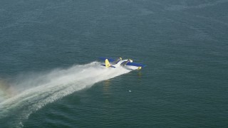 4.8K aerial stock footage of tracking a seaplane racing across San Pedro Bay for takeoff, Long Beach, California Aerial Stock Footage | AX68_075