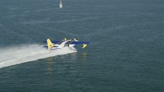 4.8K aerial stock footage track seaplane speeding across San Pedro Bay in Long Beach, California Aerial Stock Footage | AX68_076